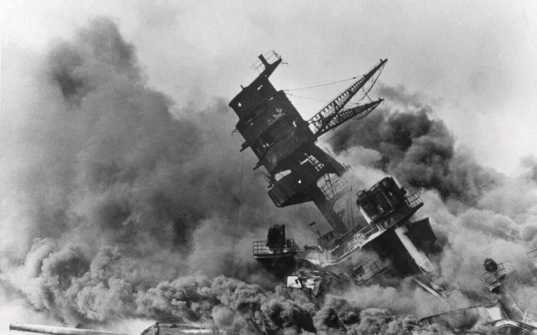 Image of a ship sinking and burning black smoke at Pearl Harbor on Dec 7, 1941